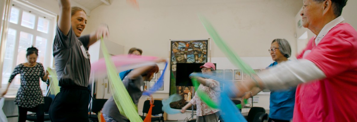 Photo of people moving in a Dance to Health session